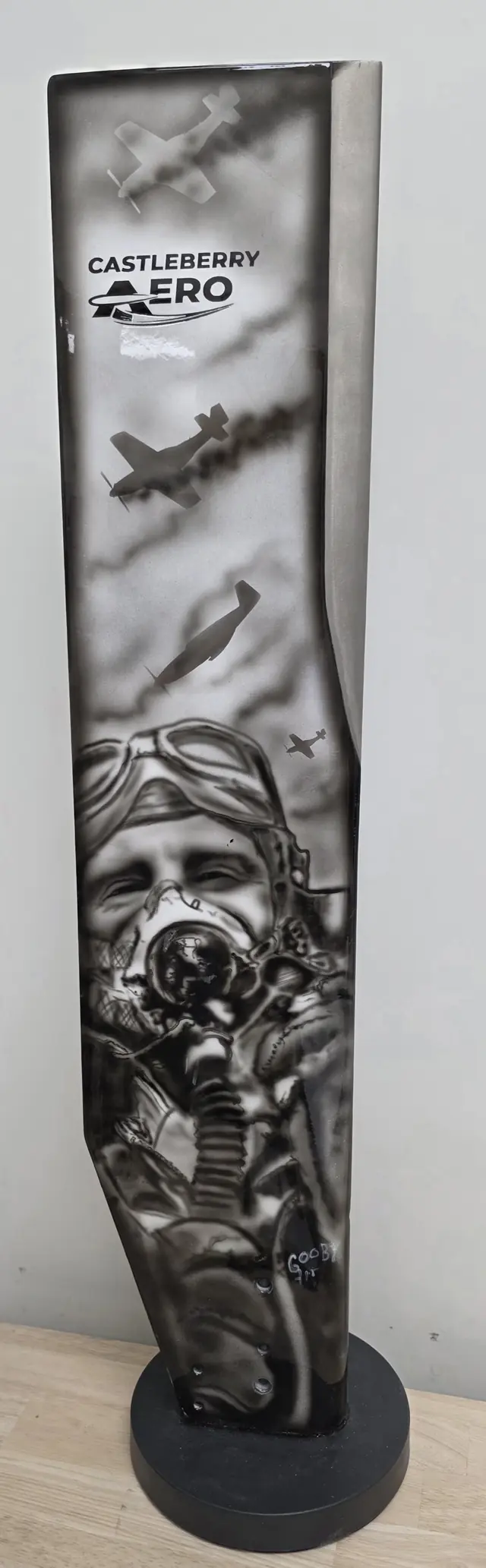 Painted propeller blade art piece on a display base: fighter aircraft over a vintage pilot in goggles and an oxygen mask, with the Castleberry Aero logo at the top