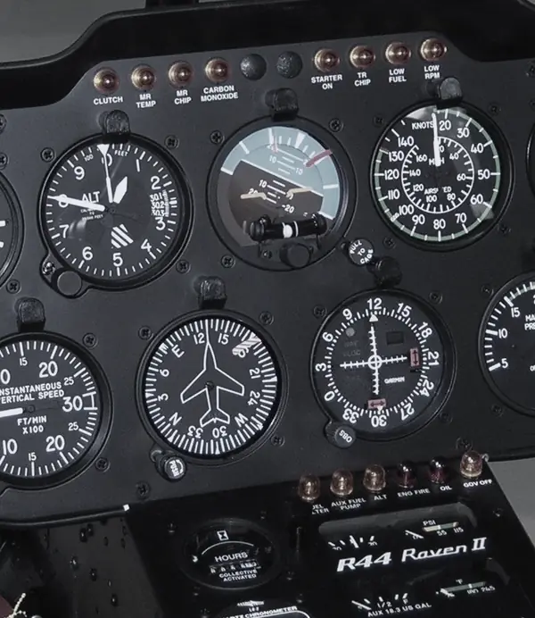 Round-dial flight instruments in a Robinson R44 Raven II helicopter panel